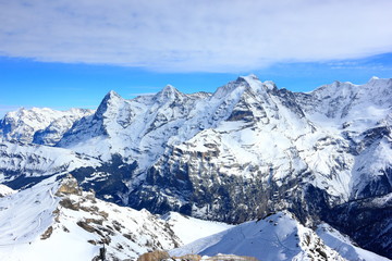 Fototapeta na wymiar View of Eiger, Mönch and Jungfrau from Schilthorn. Bernese Alps of Switzerland, Europe.