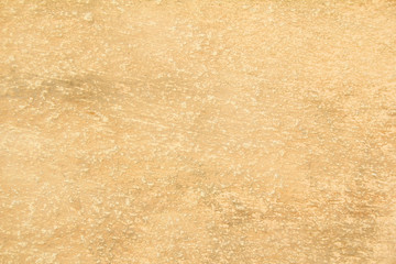 Closeup old brown beige dirty stone wall with rough surface texture background.