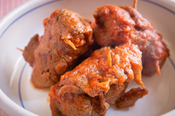 Delicious dish made of beef meat roll called braciola with tomato sauce. Apulia typical food. Italy