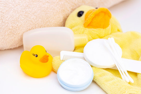 Baby Hygiene And Bath Items, Shampoo Bottle, Baby Soap, Towel, Yellow Duck Rubber Toy, Cotton Pads And Ear Sticks, Comb.