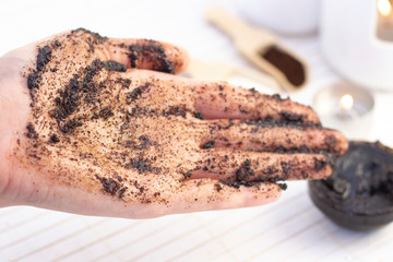Natural scrub made from coffee and sugar. hand peeling sugar scrub with coffee. spa hand treatment.
