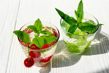 Fresh cool drink of ripe juicy cherry and gooseberry berries