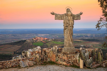 View of the Serra da Marofa viewpoint, in Portugal, at sunset, with Cristo Rei in the foreground...