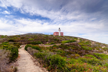Fototapeta na wymiar a lighthouse in a Mediterranean island