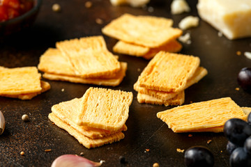 Cheese Crispies with garlic, parmesan, grape and chutney. party food snacks