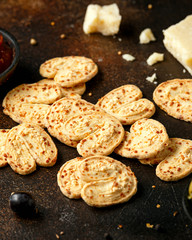 Cheese Palmiers with garlic, parmesan, grape, olives and chutney. party food snacks