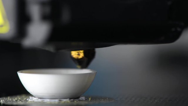 4K The 3D printer prints white plastic model of egg. modern technology. close up