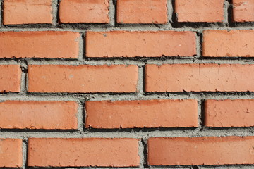 Obraz premium Brick background. Orange brick background. Loft style