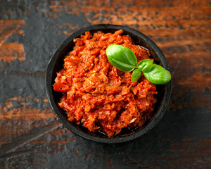 Sun dried tomato pesto with chilli, garlic and herbs in bowl