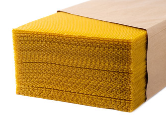 Beeswax. Wax base for honey bee rebuilding on a white background. Honeycombs.
