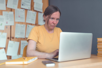 Female freelancer working from home on laptop computer
