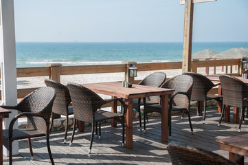 Summer terrace cafe with sea view. Tables and chairs on the summer terrace.