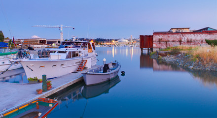 Tacoma downtown during twilight. WA with dome, lights, boats. 