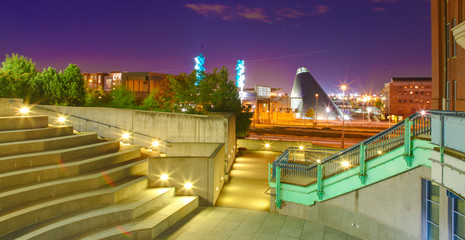 Tacoma downtown at night. WA glass museum view  night with purple sky.