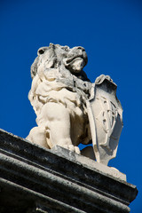 Stone lion with shield