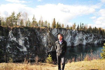 Man in Mountain park Ruskeala is tourist complex located in Sortavala region of Republic of Karelia...