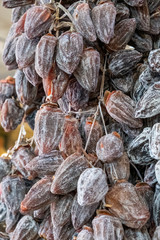 Dried persimmon berries. Large, ripened vegetables. Selling a crop in the market. Natural, healthy, vitamin-rich foods. Food for health.