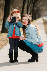 mother and daughter taking a photo