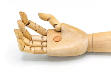 Single US penny in wooden art model hand