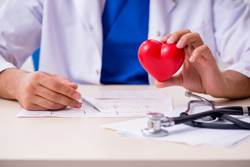 Young male doctor cardiologist working in the clinic