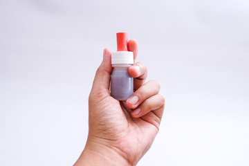 the bottle containing the vaccine in the hand