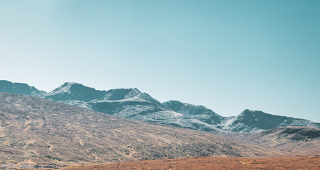 Mountain Range Against Blue Sky in Scotland