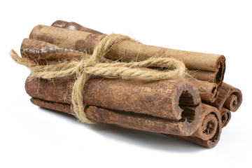 Cinnamon sticks tied with twine Isolated on a white background