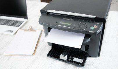 paper in printer and computer