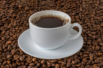 Mug of coffee, white in fried beans