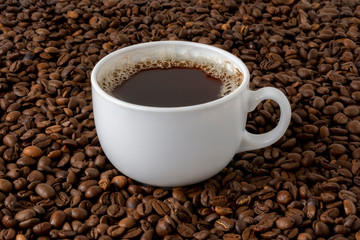 Mug of coffee, white in fried beans