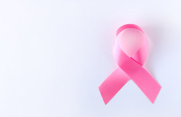 Pink ribbon on turquoise background. Breast cancer concept.