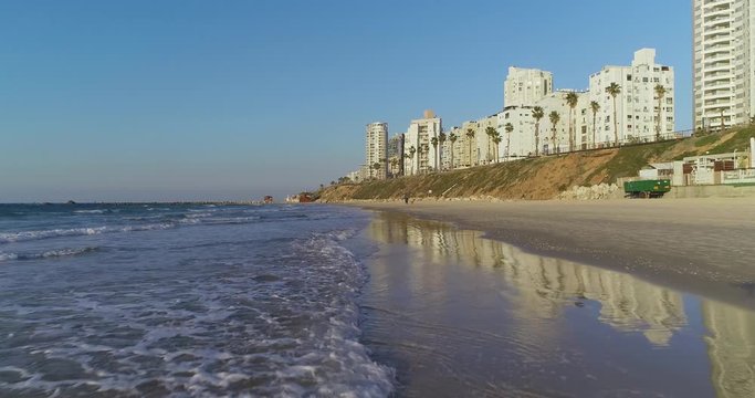 Beautiful Aerial low angle and low attitude View at empty beaches at quarantine at Bat Yam Beach And Hotels. A coastline city next to Tel Aviv - Jaffa, Israel