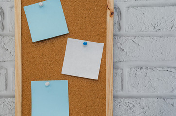 cork board reminder with stickers and push pins