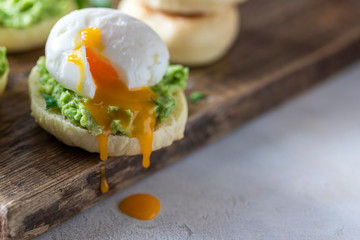 Fresh Homemade English Muffins with Avocado and Egg. Breakfast, morning concept.