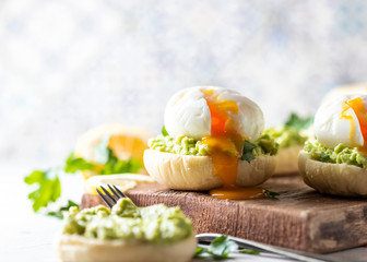 Fresh Homemade English Muffins with Avocado and Egg. Breakfast, morning concept.