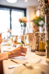 Beautiful table set for an event party or wedding reception . restaurant interior	