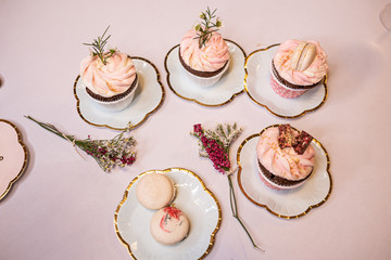 Beautiful table set for an event party or wedding reception . restaurant interior cakes on table
