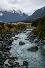 Snow peak with river in south island, Wanaka, New Zealand. Photograph in winter 2019.