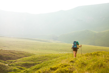 Obraz premium Young people are hiking in Carpathian mountains in summertime