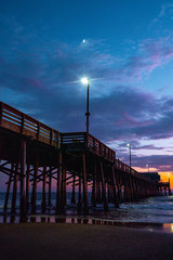 Low angle view of Newport Beach Pier during sunset