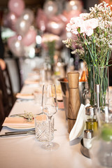 Beautiful table set for an event party or wedding reception . restaurant interior flowers	