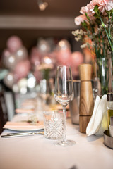 Beautiful table set for an event party or wedding reception . restaurant interior flowers	