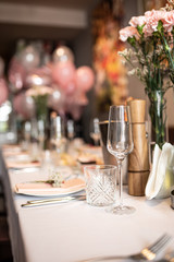 Beautiful table set for an event party or wedding reception . restaurant interior flowers	