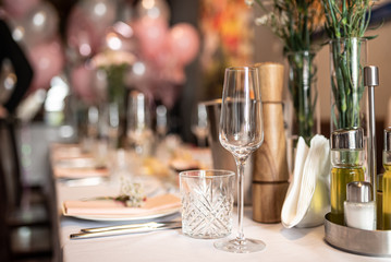 Beautiful table set for an event party or wedding reception . restaurant interior flowers	