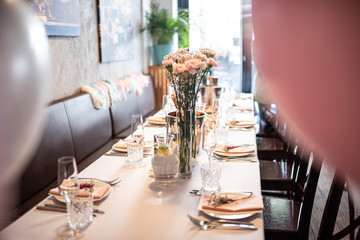 Beautiful table set for an event party or wedding reception . restaurant interior	