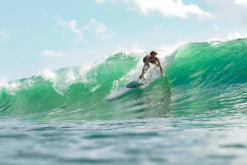 Fototapeten Boy surfing in sea © Jeremy Bishop