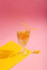 Green tea with ice on a pink background. Concept