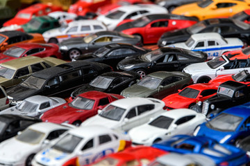 Moscow, Russia, February 2020. A mix of miniature toy cars. Lots of small toy car models, mess, top view. Background of toy cars.