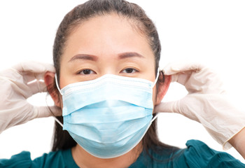 The image face  of a young Asian woman wearing a mask to prevent germs, toxic fumes, and dust. Prevention of bacterial infection in the air in a white background