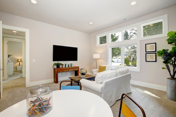 White family room and playroom. Luxury American modern home.